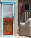 A String of Peppers Hung Outside a Pueblo Door