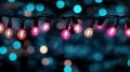 A string of pink and blue light bulbs hanging from a string of lights Royalty Free Stock Photo