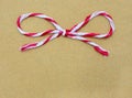 String tied in a bow, over brown paper Royalty Free Stock Photo