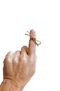 String tied on finger as reminder Royalty Free Stock Photo