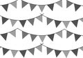 String of triangular flags or pennants in grayscale arranged in parallel, undulating lines. Royalty Free Stock Photo