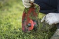 String trimmer cleaning after cutting the grass, workflow Royalty Free Stock Photo