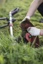 String trimmer cleaning after cutting the grass, workflow Royalty Free Stock Photo