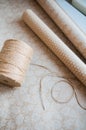 String or twine tied in a bow on kraft paper background Royalty Free Stock Photo