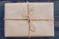 String or twine tied in a bow on kraft paper gift box texture Royalty Free Stock Photo