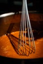 String whisk used with cooking a soup Royalty Free Stock Photo