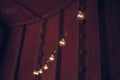 String wired bulbs inside dark room Royalty Free Stock Photo