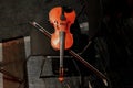 stringed instrument violin lies on a chair in the orchestra pit Royalty Free Stock Photo