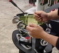 Strings a badminton racket on a racket stringing machine. Royalty Free Stock Photo