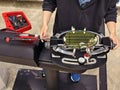 Strings a badminton racket on a racket stringing machine. Royalty Free Stock Photo