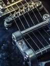 Strings and bridge of an old electric guitar Royalty Free Stock Photo