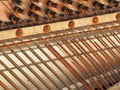 Strings and mechanics of a desolate old weathered piano