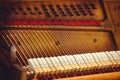 Strings of old pianoforte and hammer Royalty Free Stock Photo
