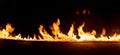 Strip of fire on a black background Royalty Free Stock Photo