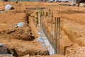 A strip foundation reinforcement frame was constructed on the house's reinforced concrete structure