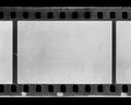 Blank 35mm film strip with film perforations, showcasing unused frames for photography enthusiasts and filmmakers Royalty Free Stock Photo
