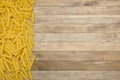 Strip raw pasta on wooden background