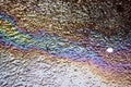 Rainbow iridescence from oil spill Royalty Free Stock Photo