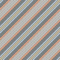 Stripe pattern multicolored background in navy blue, orange, yellow, white. Seamless diagonal herringbone graphic for spring. Royalty Free Stock Photo