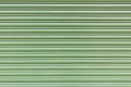 striped background of greenish interlocking lamellae Royalty Free Stock Photo