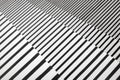 A striped background in stark black and white creates visual depth through angular lines and subtle gradients. Royalty Free Stock Photo
