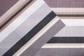 Striped background. Top view of details of colorful striped background texture with seamless pattern on plastic tissue. Macro