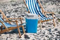 striped beach chairs and cooler