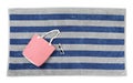 Striped beach towel with bag and sunglasses on white background, top view Royalty Free Stock Photo