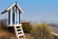 Striped blue beach hut on Filey promenade