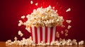 Striped box with popcorn on red background. Neural network AI generated Royalty Free Stock Photo