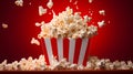 Striped box with popcorn on red background. Neural network AI generated Royalty Free Stock Photo