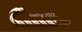 Striped brown and yellow candy cane 2023 loading bar on brown background