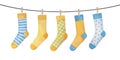 Various colorful blue and yellow socks on clothesline. Royalty Free Stock Photo