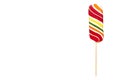 Striped color lollipop, bright cool candy. Isolated Royalty Free Stock Photo