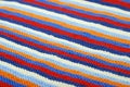 Striped diagonal background of knitted cloth.