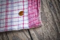 Striped dish cloth on brown wood Royalty Free Stock Photo