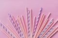 Striped drink straws of different colors in row isolated on yellow background. Minimalism concept. Pop art style. Flat Royalty Free Stock Photo