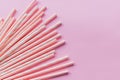 Striped drink straws of different colors in row isolated on yellow background. Minimalism concept. Pop art style. Flat Royalty Free Stock Photo