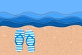 Striped flip flops on the seashore
