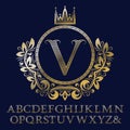 Striped gold letters and initial monogram in coat of arms form with crown. Royal font and elements kit for logo Royalty Free Stock Photo