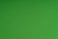 Striped green embossed paper. Colored paper. Verdant texture background.