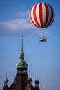 Hot air balloon flying over castle tower in VÃÂ¡rosliget Royalty Free Stock Photo