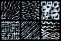 Striped, lattice, wavy textures. Set of abstract watercolor monochrome textures on a black background. Royalty Free Stock Photo