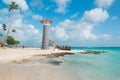 Striped lighthouse on the Caribbean beach in Dominican Republic Royalty Free Stock Photo