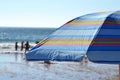 Striped parasol on the beach