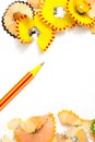 Striped pencil and colored shavings Royalty Free Stock Photo