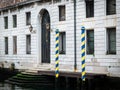 Striped poles in front of old house in Venice Royalty Free Stock Photo