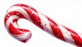 Striped Red And White Candy Cane Sprinkled with Sugar Isolated on White Background Royalty Free Stock Photo