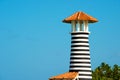 Striped red white lighthouse on the coast of the Caribbean Sea. Dominican Republic. Royalty Free Stock Photo