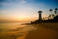 Striped red white lighthouse on the coast of the Caribbean Sea. Dominican Republic. Royalty Free Stock Photo